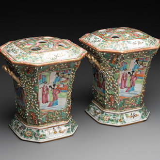 A pair of Chinese Canton famille rose flower holders and covers with figural design, 19th C.