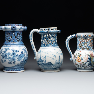 Two blue and white and one polychrome Dutch Delft puzzle jugs, dated 1734 and 1705, 18th C. and later