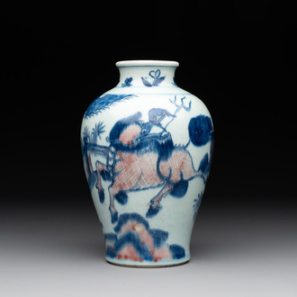A Chinese blue, white and copper-red 'kylin and phoenix' vase, 19th C.