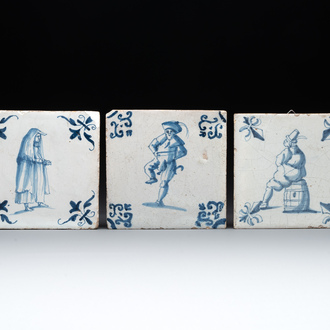 Three blue and white Dutch Delft tiles with large figures, 17th C.