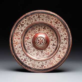 A Spanish Hispano-Moresque lustre-glazed dish with raised central medallion, Manises, 16th C.