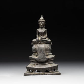 A Laotian bronze figure of a seated Buddha, 19th C.