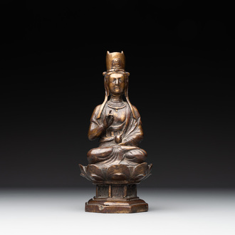 A Chinese bronze seated Guanyin on a lotus throne, probably Liao