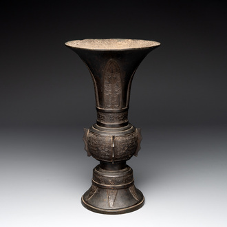 A Chinese archaistic bronze 'gu' vase with relief design, Ming