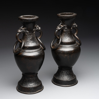 A pair of Chinese bronze vases with 'dragon' handles, Yuan/Ming