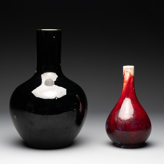 A Chinese black-glazed 'tianqiu ping' vase and a flambé-glazed bottle vase, 19/20th C.