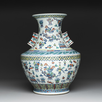 A Chinese doucai 'antiquities' 'hu' vase, Qianlong mark, 19th C.
