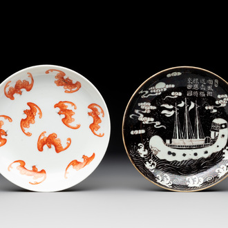 A Chinese iron-red 'bat' saucer and a black-glazed 'ship' saucer with calligraphy, Guangxu mark, 19th C.