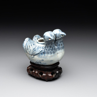 A Chinese blue and white 'double mandarin duck' ewer or water dropper on wooden stand, Ming, ca. 1500