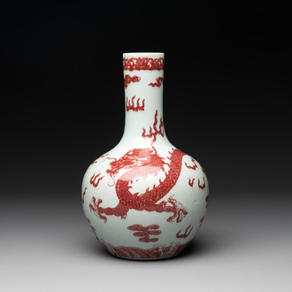 A Chinese copper-red and white 'dragon' bottle vase, 18th C.