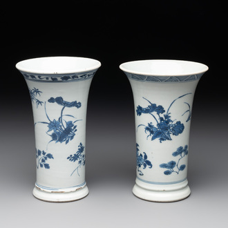A pair of Chinese blue and white beaker vases with floral sprigs, Transitional period