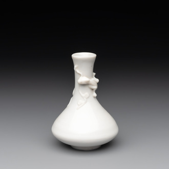 A small Chinese Dehua blanc de Chine 'dragon' bottle vase, Kangxi