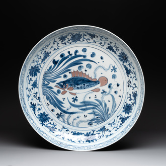 A large Chinese blue, white and copper-red 'carp' dish, 19/20th C.
