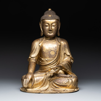 An impressive and large Chinese gilt bronze Buddha, Ming, 16th C.