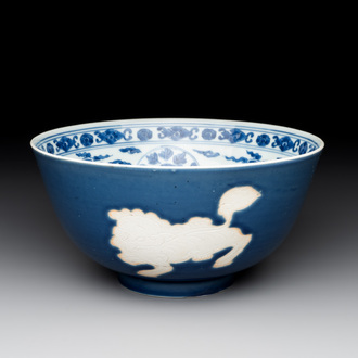 A Chinese powder blue-ground biscuit, blue and white 'Buddhist lion' bowl, Xuande mark, Kangxi