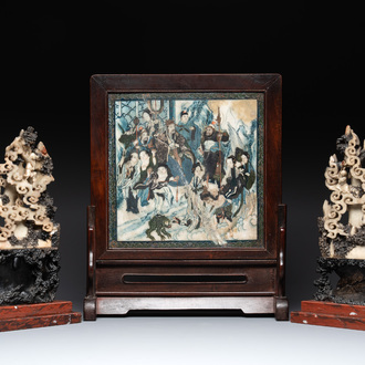A pair of Chinese carved soapstone groups and a painted alabaster and wood table screen depicting a folk tale, 18/19th C.