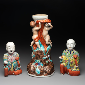 A Chinese export faux-bois stand with two putti and two famille rose boys, Qianlong/Jiaqing