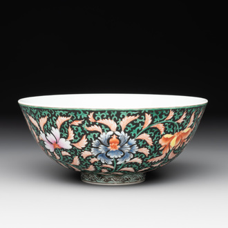 A Chinese black-ground famille rose 'flower scroll' bowl, Qianlong mark and of the period