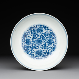 A Chinese blue and white 'flower scroll' plate, Yongzheng mark and of the period