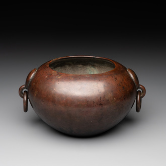 A Chinese bronze water pot with 'Taotie' handles, Xuande mark, 17/18th C.