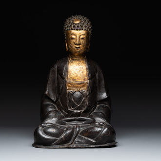 A large Chinese lacquered and gilt bronze Buddha, 17th C.