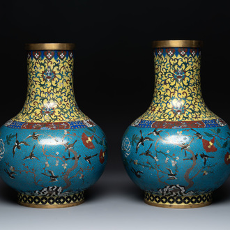 A pair of large Chinese cloisonné 'magpies among flowering branches' vases, 19th C.