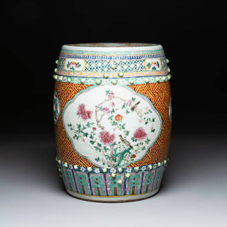 A Chinese famille rose garden seat with birds among flowering branches, 19th C.