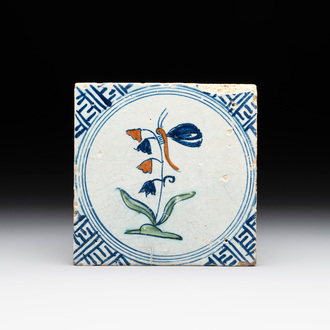A polychrome Dutch Delft 'butterfly on a campanula' tile, 17th C.