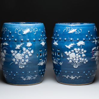 A pair of Chinese white slip-decorated blue-ground garden seats, 19th C.