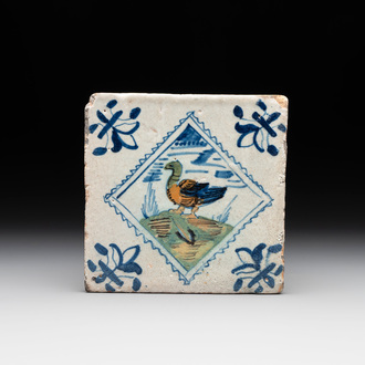 A polychrome Dutch Delft 'stamp' 'duck or goose' tile, late 16th C.