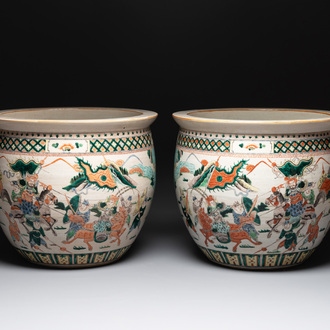 A pair of Chinese Nanking famille verte 'warriors' fish bowls, 19th C.