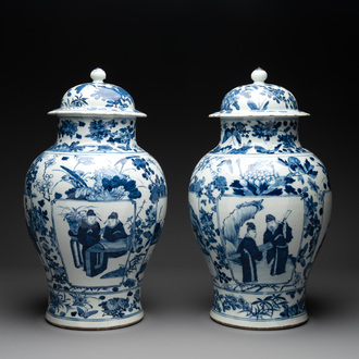 A pair of Chinese blue and white vases and covers with figural panels, 19th C.