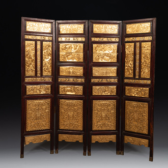 A Chinese four-part reticulated and partially gilt wooden folding screen, 19th C.