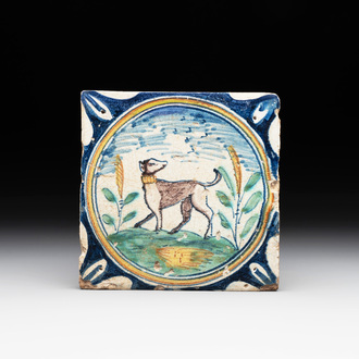 A polychrome Dutch Delft maiolica 'medallion' 'dog' tile, late 16th C.