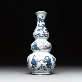 A Dutch Delft blue, white and manganese chinoiserie triple gourd vase, late 17th C.