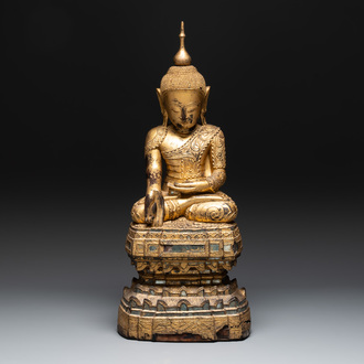 A fine Burmese mica-inlaid gilt-lacquered wooden Buddha, 19th C.