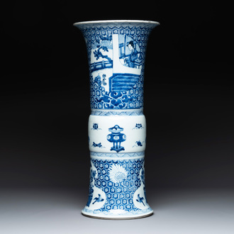 A Chinese blue and white 'gu' vase with a lady and antiquities, Kangxi