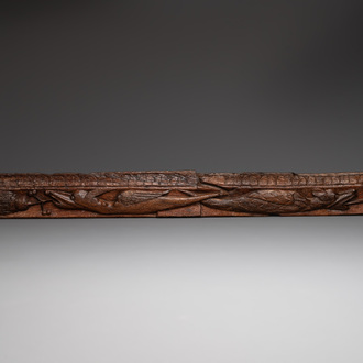 A large oak sculpted panel with two dragons and decorations, probably 13th C.