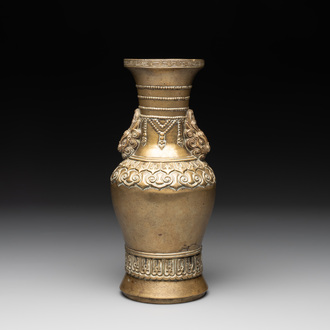 A Chinese bronze vase with lion-form handles, 17/18th C.