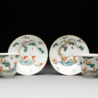 A pair of Chinese famille rose 'monkey and deer' cups and saucers, Tongzhi mark and of the period