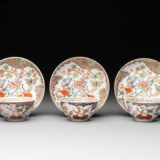 Three Chinese famille rose 'flowers and butterflies' cups and saucers, Yongzheng