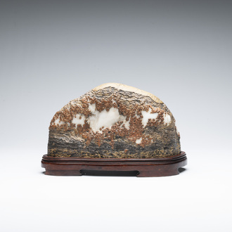 A Chinese wucai Lingbi stone scholar's rock on wooden stand, 20th C.