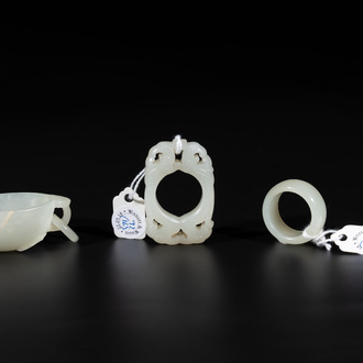 A Chinese white jade cup and two rings, Qing