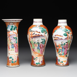 A Chinese famille rose 'mandarin subject' garniture of three vases, Qianlong