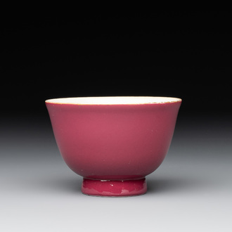A fine Chinese ruby-ground famille rose 'magnolia' cup, Qianlong mark and of the period