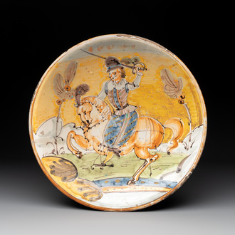 An Italian maiolica dish with a swordsman on horse, Montelupo, early 17th C.