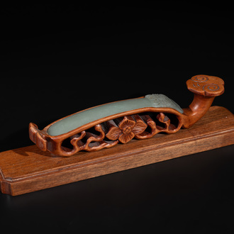 A Chinese pale celadon jade 'double happiness' hairpin on a ruyi-shaped wooden stand, 19th C.