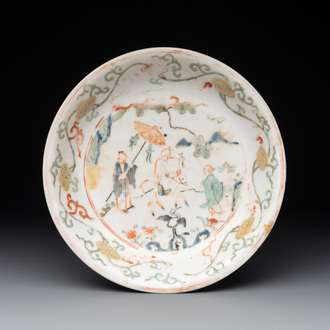A Chinese wucai shipwreck plate with figures in a landscape, Wanli