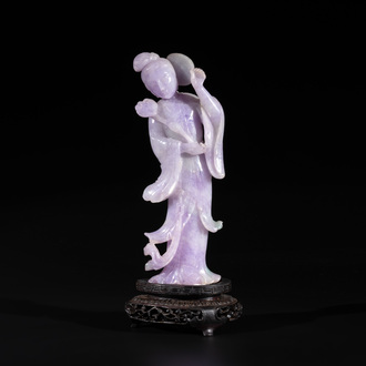 A Chinese lavender- and mint-green-jade figure of a goddess holding a sceptre and fan on wooden stand, 19th C.