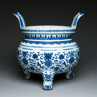 A large Chinese blue and white 'bajixiang' and 'lotus scrolls' tripod censer, Qianlong